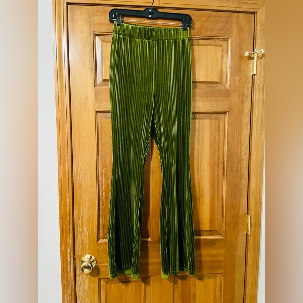 Fitted women’s green cord style flare pants